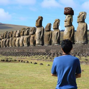 One man admiring the huge Moai statues of Ahu Tongariki, Easter Island, Chile, South America