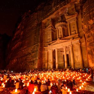 Al Khazneh in the ancient city of Petra, Jordan at night. It is known as The Treasury. Petra has led to its designation as a UNESCO World Heritage Site.